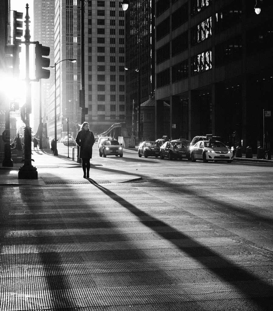 Black and white street photography with long shadows